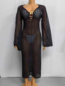 Detail of deep V-neck hollow mesh dress with a golden starfish metal decoration