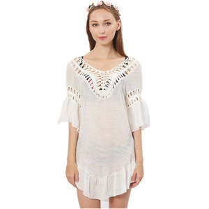 White crochet lace beach cover-up with deep V-neck, flared sleeves and ruffled hem