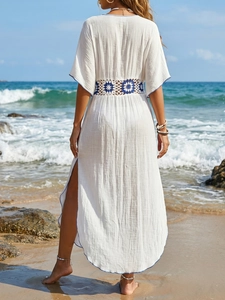 White beach cover-up maxi dress with blue crochet waist detail and side slits