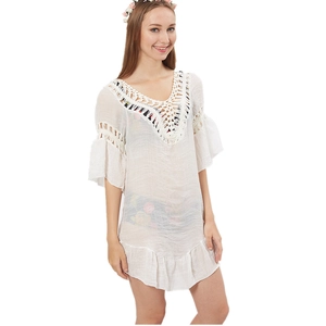 White boho crochet knit beach cover up with flared sleeves and ruffle hem details