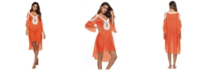 Detail view of orange beach cover-up with crochet neckline and high-low hem design