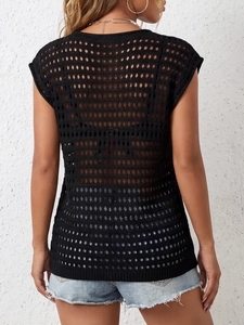 Close-up of black hollow-out mesh knit cover-up showing back detail and lace-up design