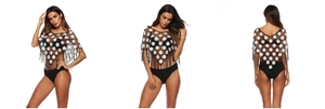 Detail view of black crochet beach shawl with white daisy patterns and long fringe tassels