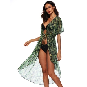 Detail of green tropical leaf print chiffon cover-up with tie-front and sheer fabric