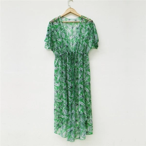 Detail of tropical palm leaf print chiffon cover-up with drawstring waist and ruffles