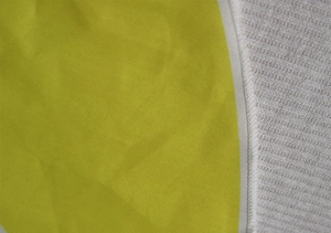 Detail shot of pizza beach shawl fabric with lime yellow plain weave and white ribbed knit