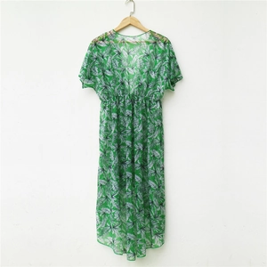 Detail view of tropical green leaf print chiffon cover-up with V-neck and elastic waist