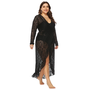 Close-up detail of sheer floral lace fabric on this black long sleeve beach maxi dress