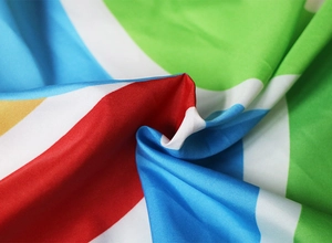 Detailed macro view showing the smooth texture and vibrant geometric print of the fabric