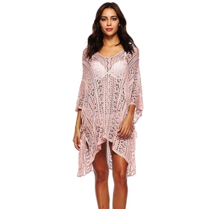 Macro detail of pink crochet hollow-out V-neck beach cover-up with batwing sleeves