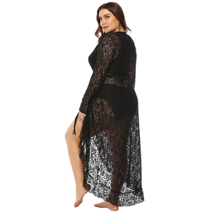Detailed view of black lace long sleeve maxi dress with side slit and floral embroidery