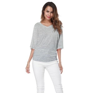 Detail showing the elegant V-neckline and soft heather grey texture of this loose T-shirt