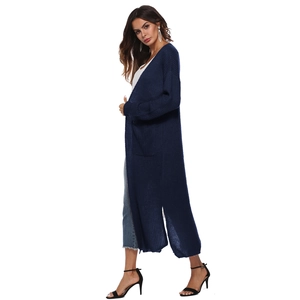 Detail view of long dark blue knit cardigan featuring side slits and large side pockets