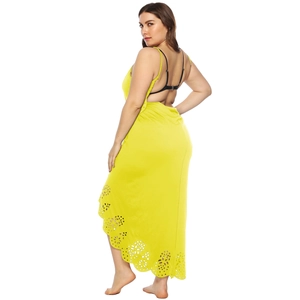 Detail of yellow backless maxi dress with laser-cut floral patterns and delicate straps