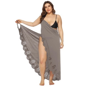 Detail of grey plus size beach sarong with laser cut floral hem and breathable fabric