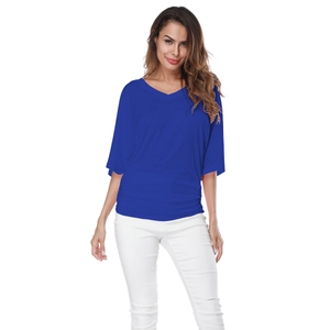 Close-up of the V-neck design and ruched waist detail on a royal blue short sleeve top
