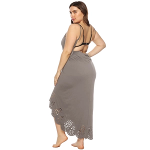 Detail of the laser-cut hollow floral pattern on the grey open-back long beach dress