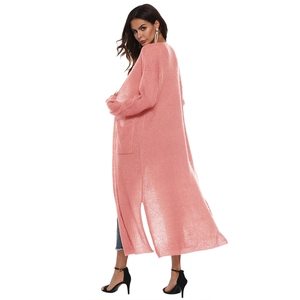 Detail of pink longline crochet knit cardigan featuring a side slit and sheer texture