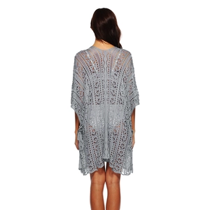 Back view of gray crochet beach cover-up featuring intricate hollow knit and batwing sleeves
