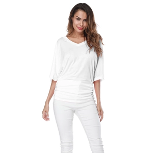 Detail of the white V-neck loose fit blouse with waist pleats and drop shoulder sleeves