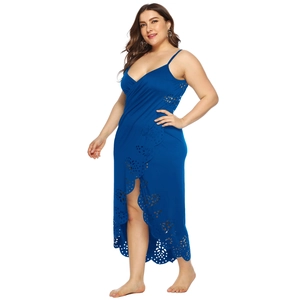 Detailed laser-cut floral patterns on a dark blue plus size wrap beach dress