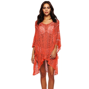 Detail of hollow-out lace patterns on this coral V-neck beach cover-up with batwing sleeves