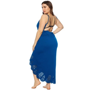 Detail view of plus size dark blue beach dress with laser-cut floral hem and backless design