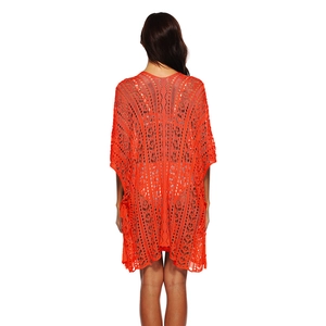 Detailed back view of orange crochet lace beach cover-up with intricate hollow-out patterns