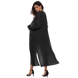 Detail view of the deep grey long knit cardigan with stylish side slits and chunky texture