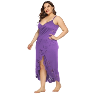 Detailed view of purple beach cover-up dress featuring laser-cut floral hem and wrap design
