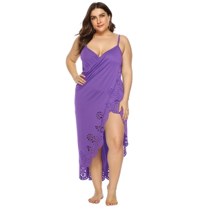 Detail of laser-cut floral pattern on purple plus-size beach wrap dress with thin straps