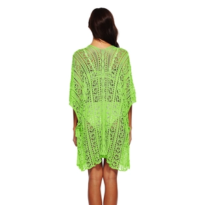 Detailed back view of neon green crochet beach cover-up showing geometric hollow patterns