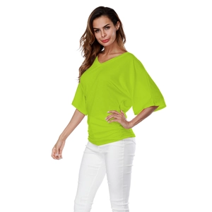 Detail of neon green V-neck top showing ruched side seams and batwing sleeves