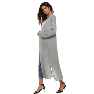 Detail view of the long grey knitted cardigan featuring side slits and deep side pockets