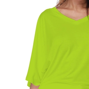 Detailed view of the V-neckline and high-quality neon green knit fabric of this loose top