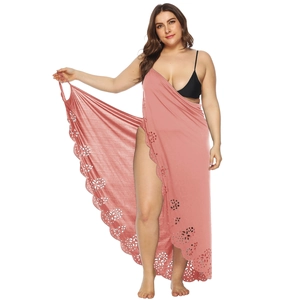 Detailed laser-cut floral pattern and high slit on this pink beach cover-up dress