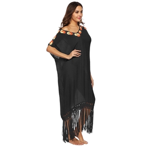 Bohemian black beach cover-up with crochet embroidery, V-neck, and long fringe hemline