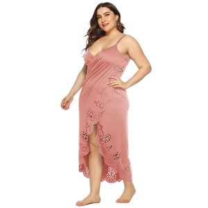 Detail of pink plus size beach dress with laser-cut floral patterns and V-neckline