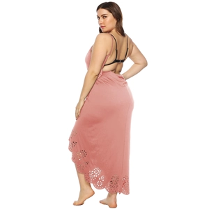 Detail of laser-cut floral pattern and backless design on dusty pink maxi dress
