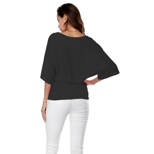 Rear view of loose fit black batwing sleeve top with vertical center seam detail