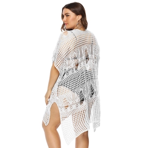 White crochet knit beach cover-up with hollow mesh and side slits in a loose fit