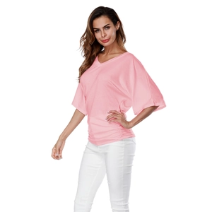 Detailed view of the V-neckline and side pleated ruching on this pink batwing sleeve top
