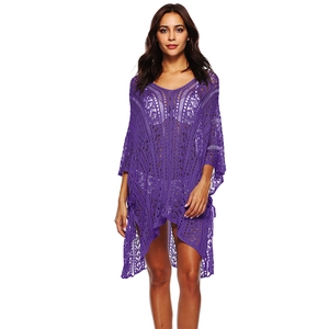 Close-up of vibrant purple crochet beach cover-up with hollow geometric patterns