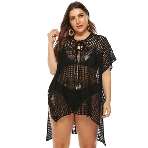 Detail of plus size black mesh beach cover-up with crochet knit and lace-up neck