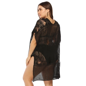 Detail view of black hollow knit beach cover-up with side slit and mesh texture
