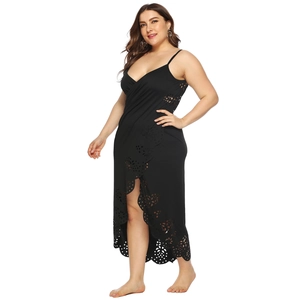 Detail of laser-cut floral patterns on a plus-size black beach wrap dress with V-neck