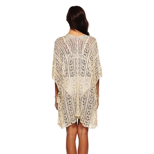 Rear view of beige crochet beach cover-up with intricate geometric hollow-out patterns