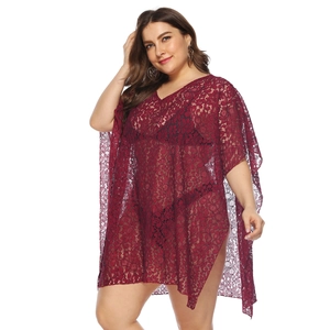 Detail of burgundy floral lace beach cover-up with V-neckline and sheer crochet pattern