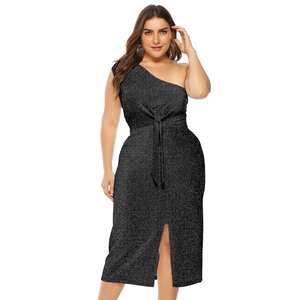 Detail of black glitter off-shoulder dress featuring waist tie and elegant side split