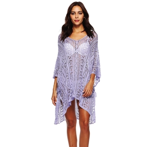 Close-up of purple crochet beach cover-up showing delicate lace knit and V-neckline texture